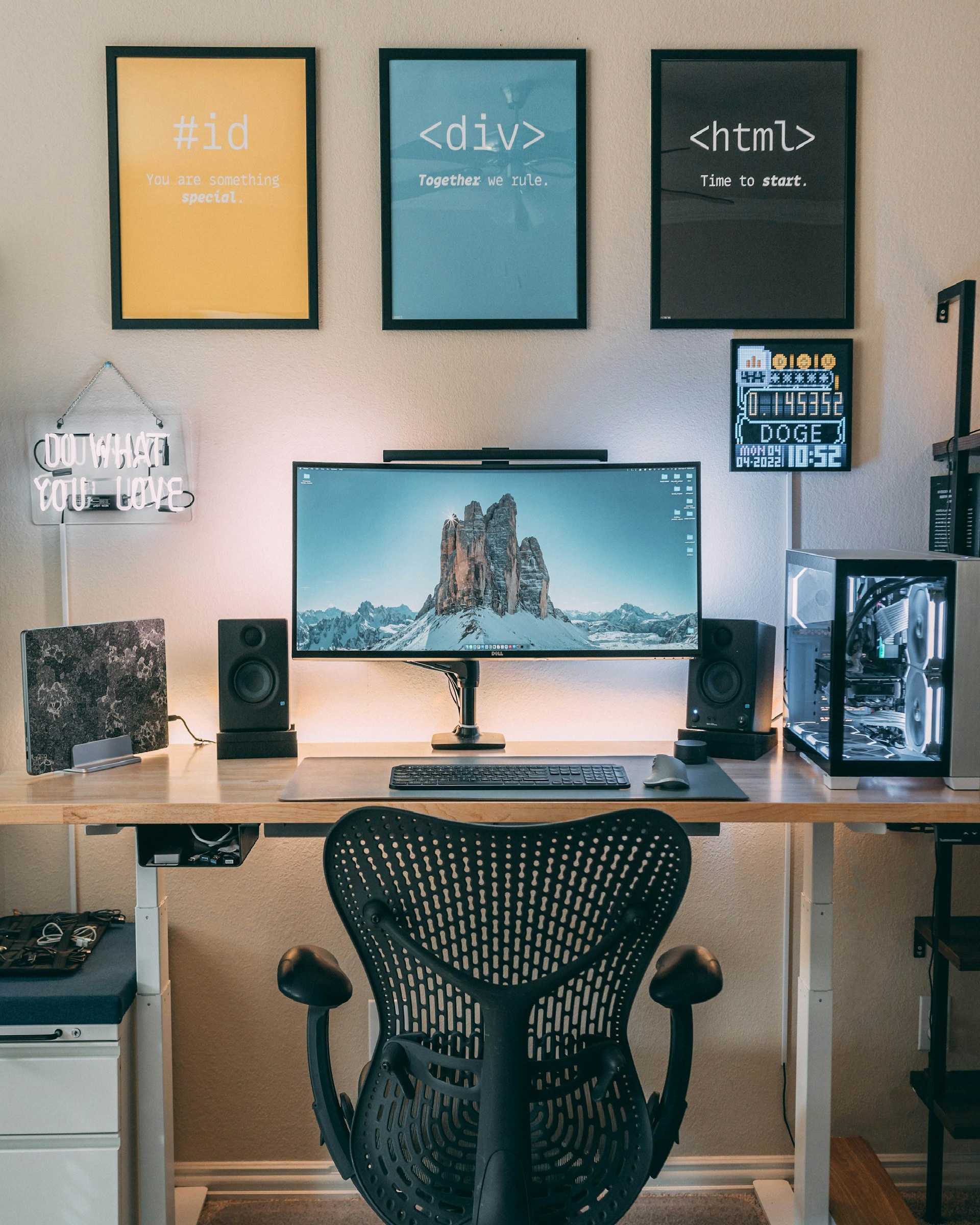 Design system with colour palettes, typography and interface components displayed on a desktop monitor